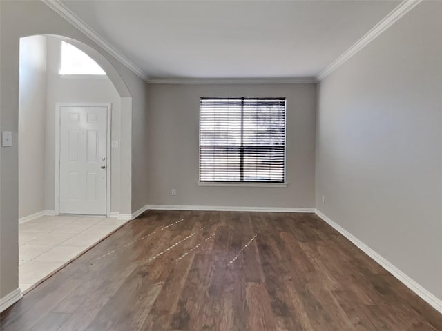 1104 Cactus Spine Dr, Fort Worth, TX 76052 - spare room featuring arched walkways, wood finished floors, crown molding, and baseboards