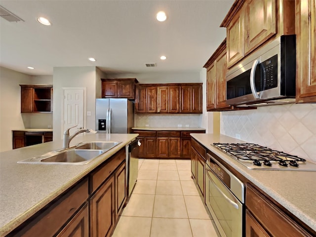 1104 Cactus Spine Dr, Fort Worth, TX 76052 - kitchen featuring appliances with stainless steel finishes, a sink, backsplash, recessed lighting, and light tile patterned floors