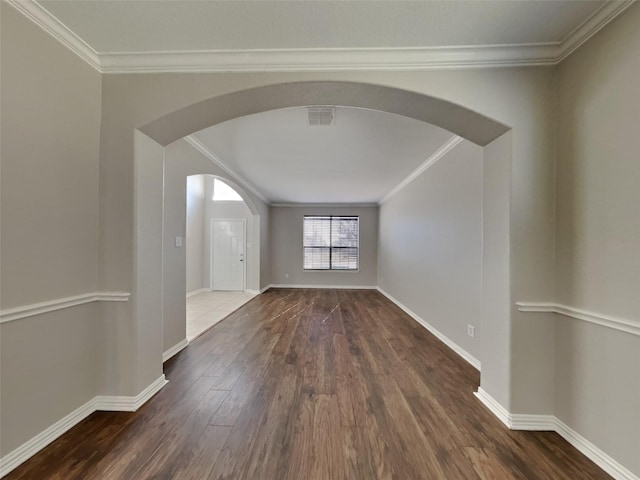 1104 Cactus Spine Dr, Fort Worth, TX 76052 - empty room featuring ornamental molding, arched walkways, wood finished floors, and baseboards