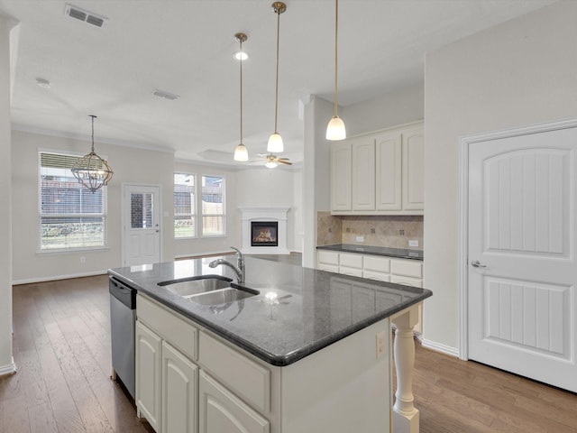 125 Gill Point Ln, Aledo, TX 76008 - kitchen with a sink, dishwasher, dark wood-type flooring, ceiling fan, and decorative backsplash