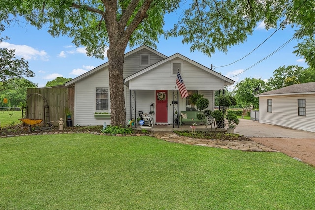 6440 Harmonson Rd, North Richland Hills, TX 76180 - view of front of home featuring a porch and driveway
