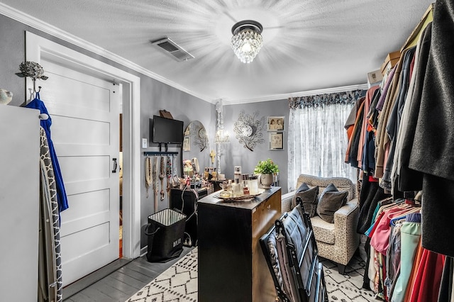 6440 Harmonson Rd, North Richland Hills, TX 76180 - spacious closet with a chandelier and wood finished floors