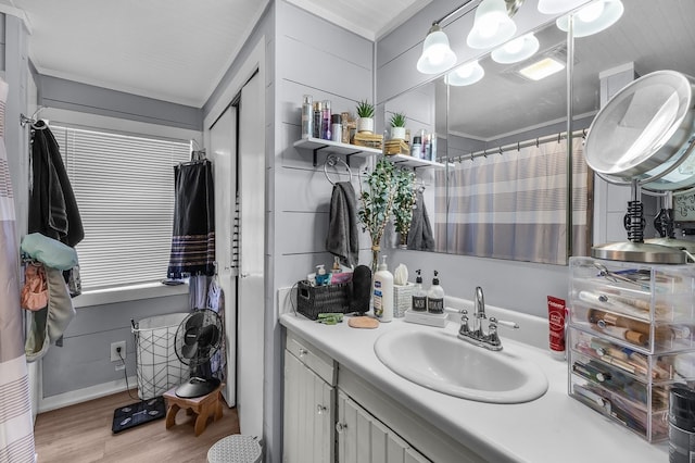 6440 Harmonson Rd, North Richland Hills, TX 76180 - full bathroom with vanity, wood finished floors, a shower with curtain, and crown molding