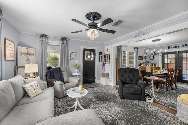 6440 Harmonson Rd, North Richland Hills, TX 76180 - living room featuring a chandelier, ceiling fan, ornamental molding, healthy amount of natural light, and wood finished floors