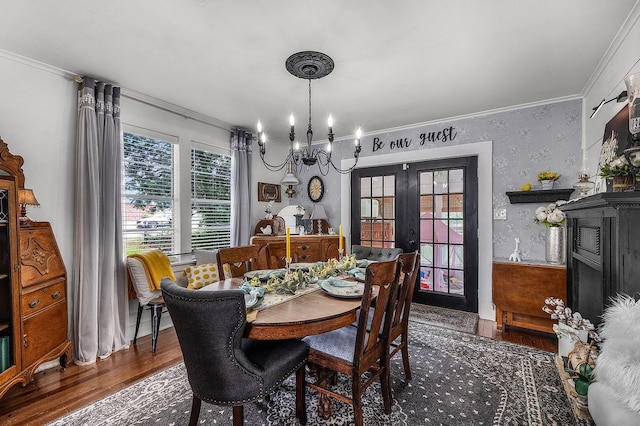6440 Harmonson Rd, North Richland Hills, TX 76180 - dining space featuring french doors, crown molding, wood finished floors, and a chandelier