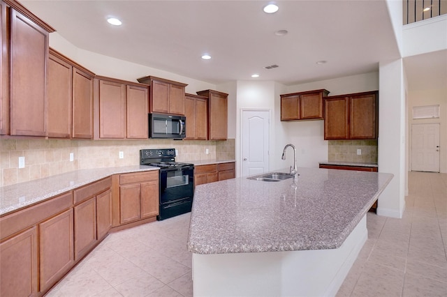 8721 Maple Ridge Rd, Fort Worth, TX 76244 - kitchen with black appliances, a sink, recessed lighting, decorative backsplash, and light stone countertops