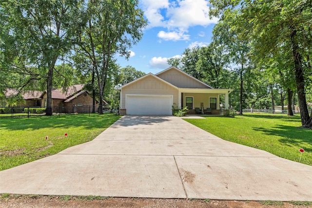 103 Idlewood Rd, Enchanted Oaks, TX 75156 - view of front facade with an attached garage, driveway, and a porch