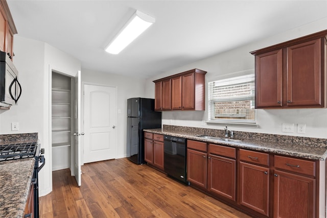 2118 Cone Flower Dr, Forney, TX 75126 - kitchen featuring black appliances, a sink, and dark wood-style floors