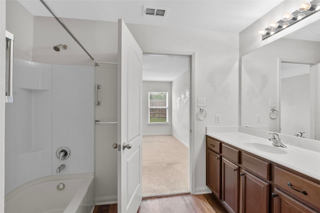 2118 Cone Flower Dr, Forney, TX 75126 - full bath with vanity, shower / washtub combination, wood finished floors, and baseboards