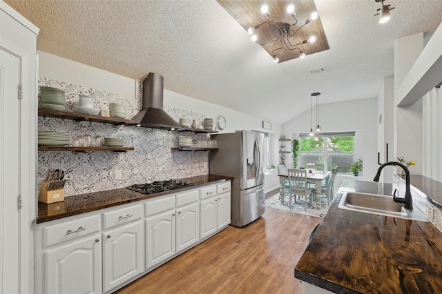 1600 Country Walk Ln, Wylie, TX 75098 - kitchen with a sink, stainless steel refrigerator with ice dispenser, dark countertops, island range hood, and open shelves