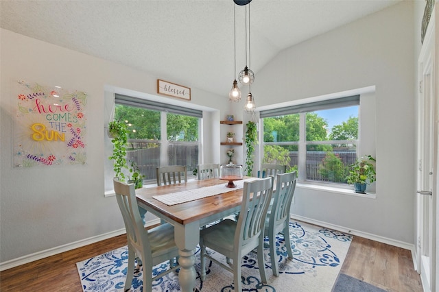 1600 Country Walk Ln, Wylie, TX 75098 - dining space with wood finished floors, vaulted ceiling, and baseboards