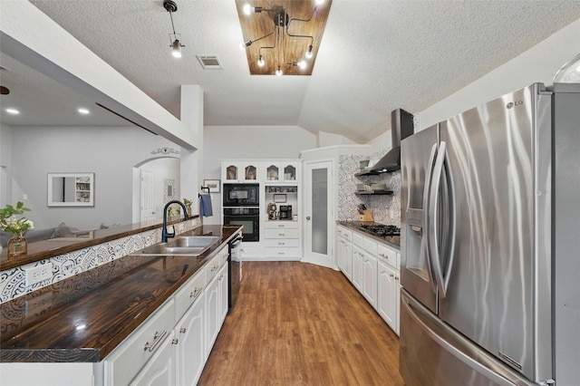 1600 Country Walk Ln, Wylie, TX 75098 - kitchen with stainless steel refrigerator with ice dispenser, a sink, wall chimney exhaust hood, open shelves, and black microwave