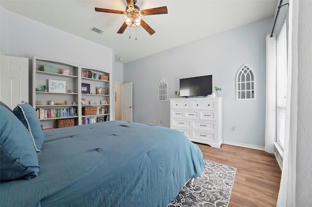 1600 Country Walk Ln, Wylie, TX 75098 - bedroom with light wood finished floors, baseboards, and a ceiling fan