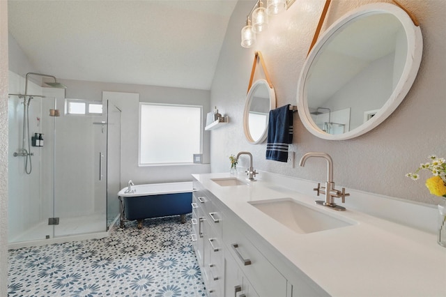 1600 Country Walk Ln, Wylie, TX 75098 - bathroom featuring a stall shower, a soaking tub, double vanity, a textured wall, and tile patterned floors