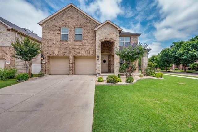 816 Hartsfield St, Aubrey, TX 76227 - traditional home with brick siding, driveway, a front yard, an attached garage, and stone siding