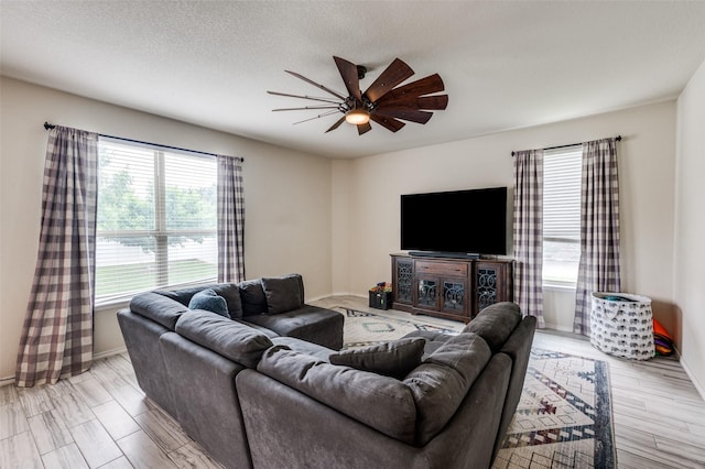 816 Hartsfield St, Aubrey, TX 76227 - living area with ceiling fan, light wood-type flooring, and baseboards
