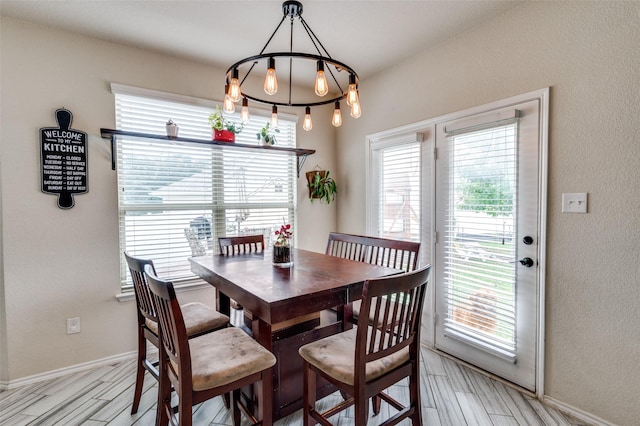 816 Hartsfield St, Aubrey, TX 76227 - dining space featuring light wood-style floors, baseboards, and a chandelier