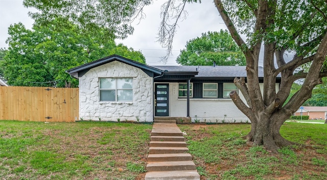 611 Cannon Dr, Euless, TX 76040 - view of front facade featuring stone siding and a shingled roof