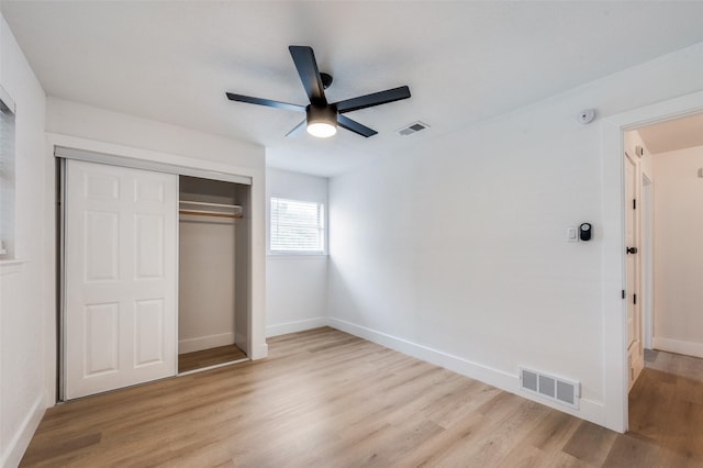 611 Cannon Dr, Euless, TX 76040 - unfurnished bedroom with light wood finished floors, a closet, baseboards, and ceiling fan