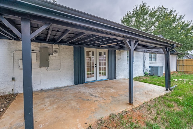 611 Cannon Dr, Euless, TX 76040 - view of patio / terrace with central AC, french doors, and electric panel