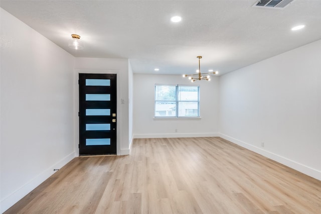 611 Cannon Dr, Euless, TX 76040 - foyer with light wood-style floors, a chandelier, baseboards, and recessed lighting