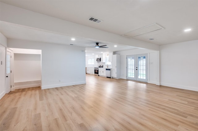 611 Cannon Dr, Euless, TX 76040 - unfurnished living room featuring attic access, baseboards, light wood-style floors, recessed lighting, and ceiling fan