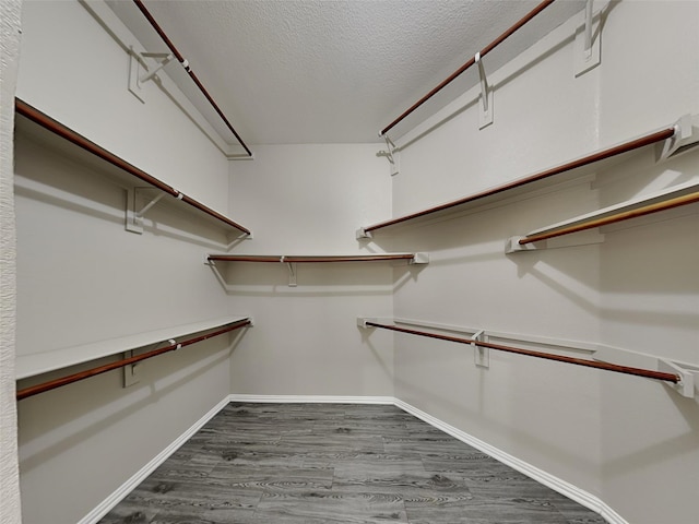 529 Covey Trl, Rockwall, TX 75087 - spacious closet featuring dark wood-style flooring