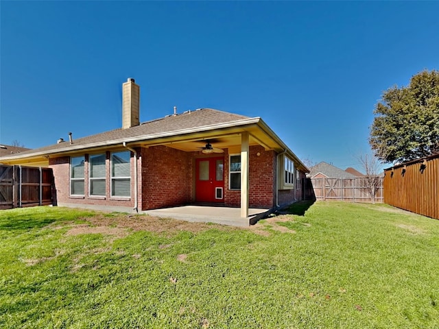 529 Covey Trl, Rockwall, TX 75087 - rear view of property featuring a patio area, a chimney, brick siding, and ceiling fan