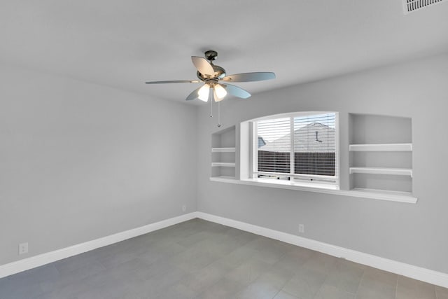 2111 Devonblue Dr, Forney, TX 75126 - empty room with a ceiling fan, built in shelves, and baseboards