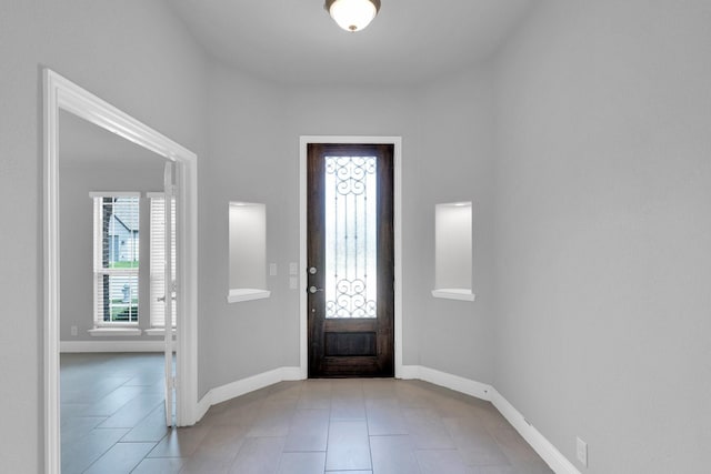 2111 Devonblue Dr, Forney, TX 75126 - foyer entrance featuring light tile patterned floors and baseboards