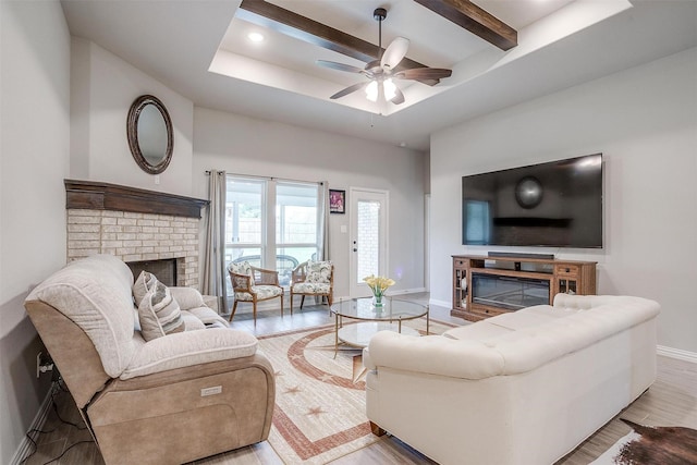 812 Porcupine Dr, Springtown, TX 76082 - living area with a fireplace, baseboards, wood finished floors, ceiling fan, and beamed ceiling