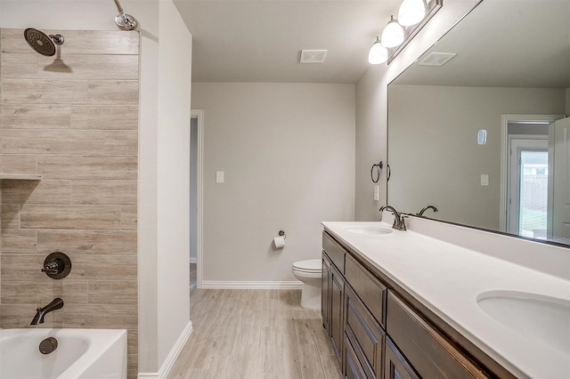 812 Porcupine Dr, Springtown, TX 76082 - bathroom featuring double vanity, baseboards, wood finished floors, toilet, and  shower combination