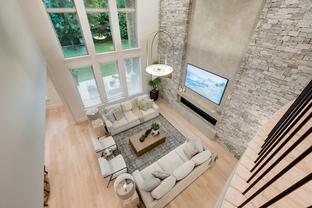 912 Berkshire Rd, Southlake, TX 76092 - living room with wood finished floors, a towering ceiling, and baseboards