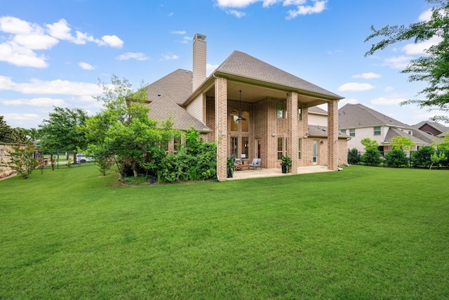 912 Berkshire Rd, Southlake, TX 76092 - rear view of house featuring a patio, a chimney, a ceiling fan, brick siding, and a shingled roof