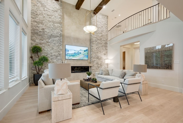 912 Berkshire Rd, Southlake, TX 76092 - living area featuring a towering ceiling, plenty of natural light, beamed ceiling, wood finished floors, and baseboards
