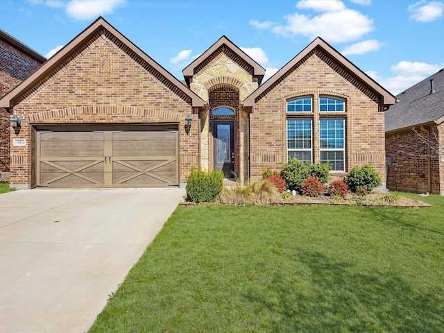 14824 Angel Trace Dr, Aledo, TX 76008 - french country home featuring brick siding, driveway, an attached garage, and a front yard