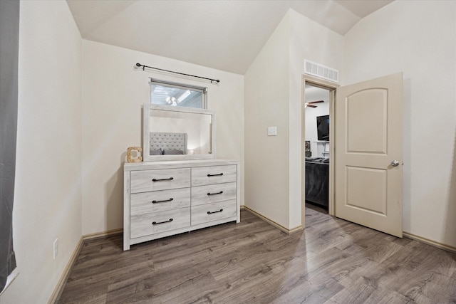 10149 High Eagle Trl, Fort Worth, TX 76108 - bedroom featuring vaulted ceiling, wood finished floors, and baseboards