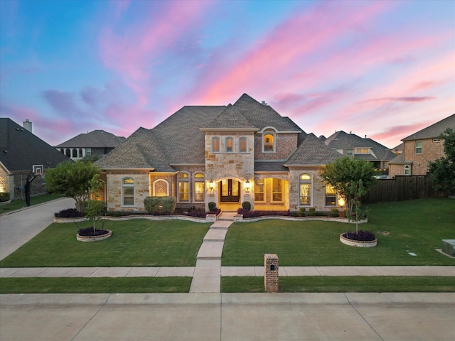 1741 Mountain Creek Ln, Prosper, TX 75078 - french country inspired facade featuring stone siding