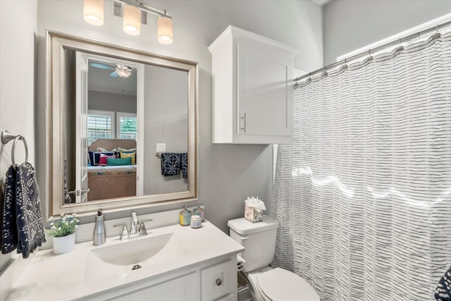 1741 Mountain Creek Ln, Prosper, TX 75078 - bathroom featuring vanity, toilet, connected bathroom, ceiling fan, and a shower with shower curtain