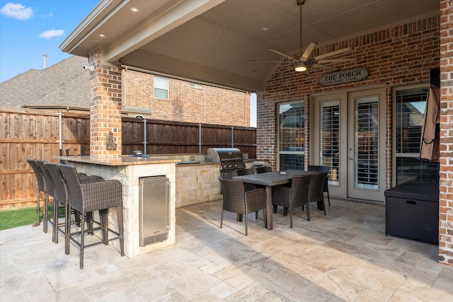 1741 Mountain Creek Ln, Prosper, TX 75078 - fenced backyard featuring a patio, a bar, ceiling fan, and outdoor dining area