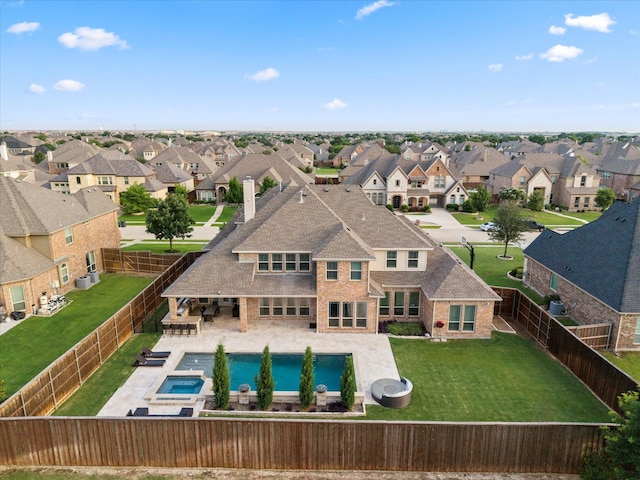 1741 Mountain Creek Ln, Prosper, TX 75078 - view of swimming pool featuring a residential view, a patio, and a pool with connected hot tub