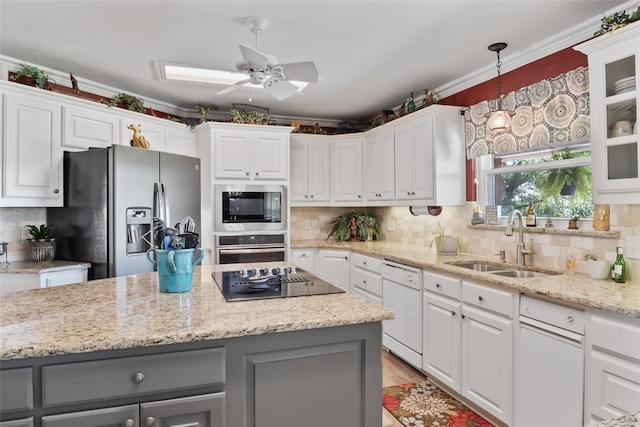 10595 Gregory Rd, Sanger, TX 76266 - kitchen featuring black appliances, a sink, gray cabinets, ceiling fan, and white cabinets