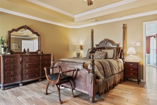 10595 Gregory Rd, Sanger, TX 76266 - bedroom with light wood-style floors, crown molding, a tray ceiling, and baseboards