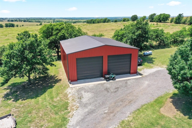 10595 Gregory Rd, Sanger, TX 76266 - detached garage with driveway and a view of rural / pastoral area