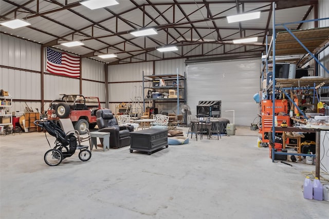 10595 Gregory Rd, Sanger, TX 76266 - garage featuring a workshop area and metal wall