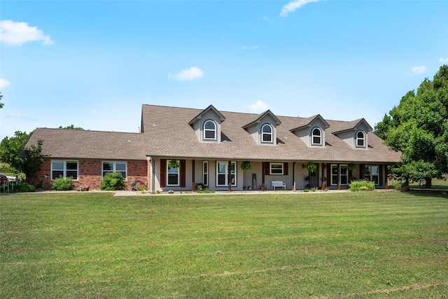 10595 Gregory Rd, Sanger, TX 76266 - cape cod house featuring covered porch, a front lawn, and roof with shingles