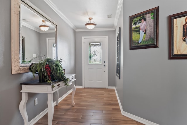 10595 Gregory Rd, Sanger, TX 76266 - entrance foyer featuring wood finished floors, baseboards, and ornamental molding