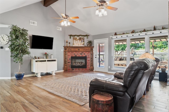 10595 Gregory Rd, Sanger, TX 76266 - living area featuring a ceiling fan, high vaulted ceiling, wood finished floors, plenty of natural light, and beam ceiling