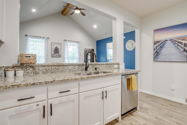 3108 Ridgecrest Dr, Granbury, TX 76048 - kitchen featuring stainless steel dishwasher, a sink, a ceiling fan, light stone counters, and white cabinetry
