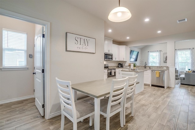 3108 Ridgecrest Dr, Granbury, TX 76048 - dining room featuring light wood-style floors, recessed lighting, and baseboards